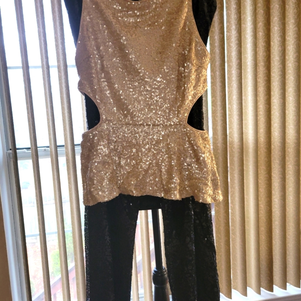 Sequined Gold peplum top lined with side cutouts